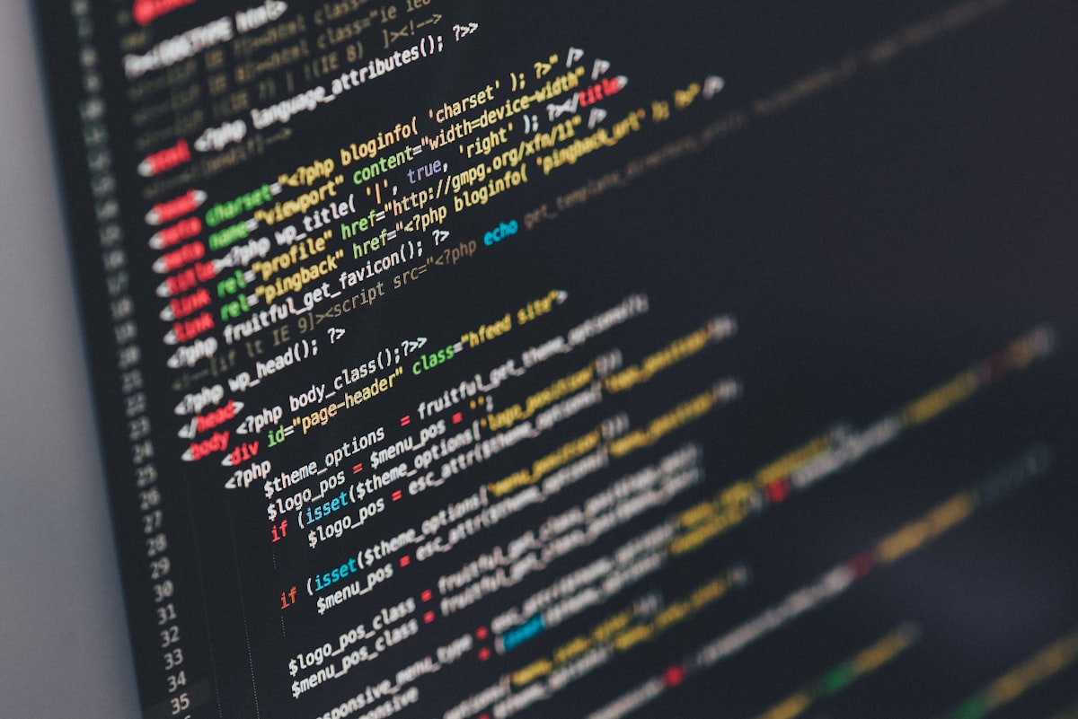 Developer writing code on a monitor